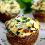 closeup of Spinach Artichoke Stuffed Mushroom on white plate