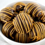 closeup of Chocolate Peanut Butter Truffles in white bowl