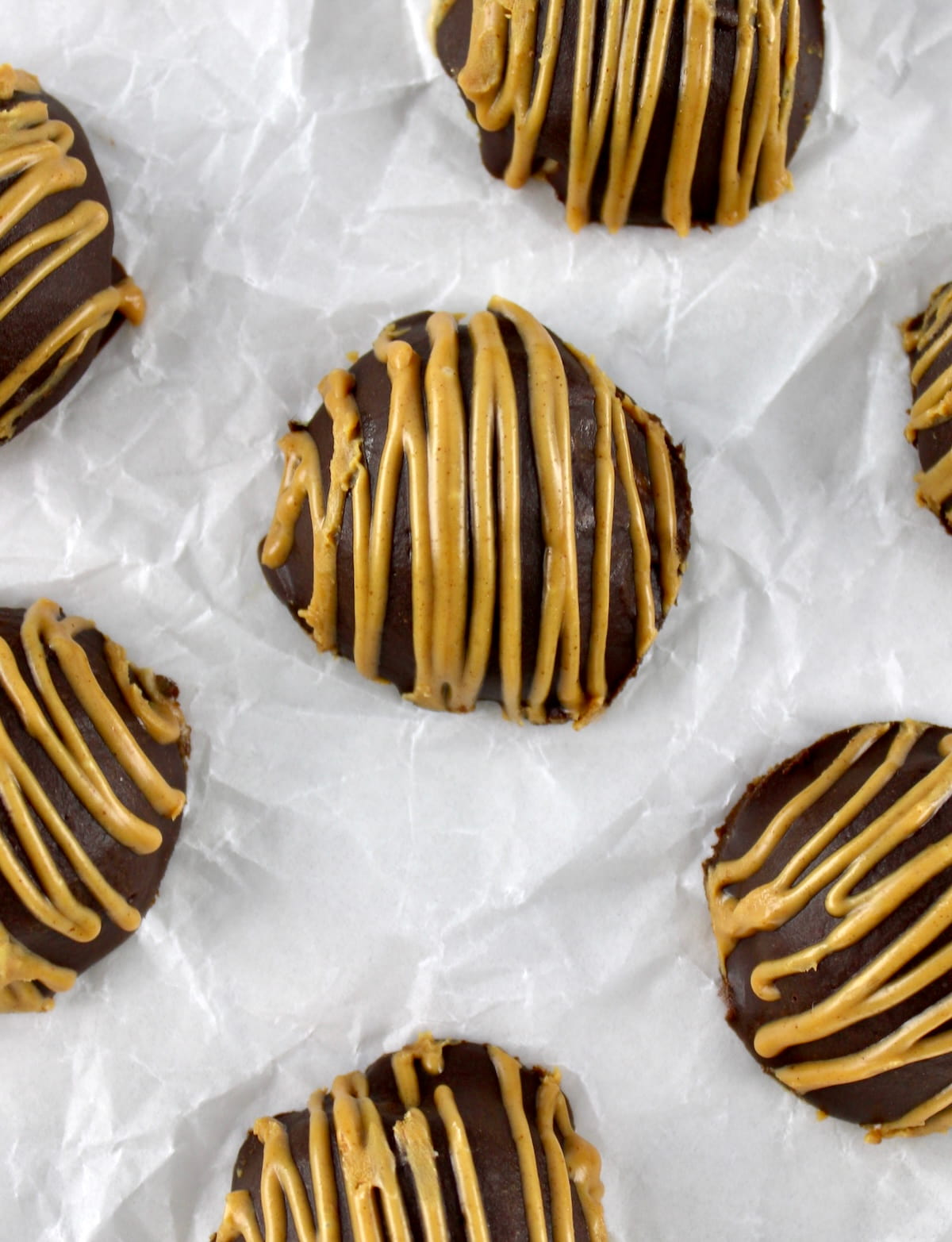 overhead view of Chocolate Peanut Butter Truffles on white parchment paper