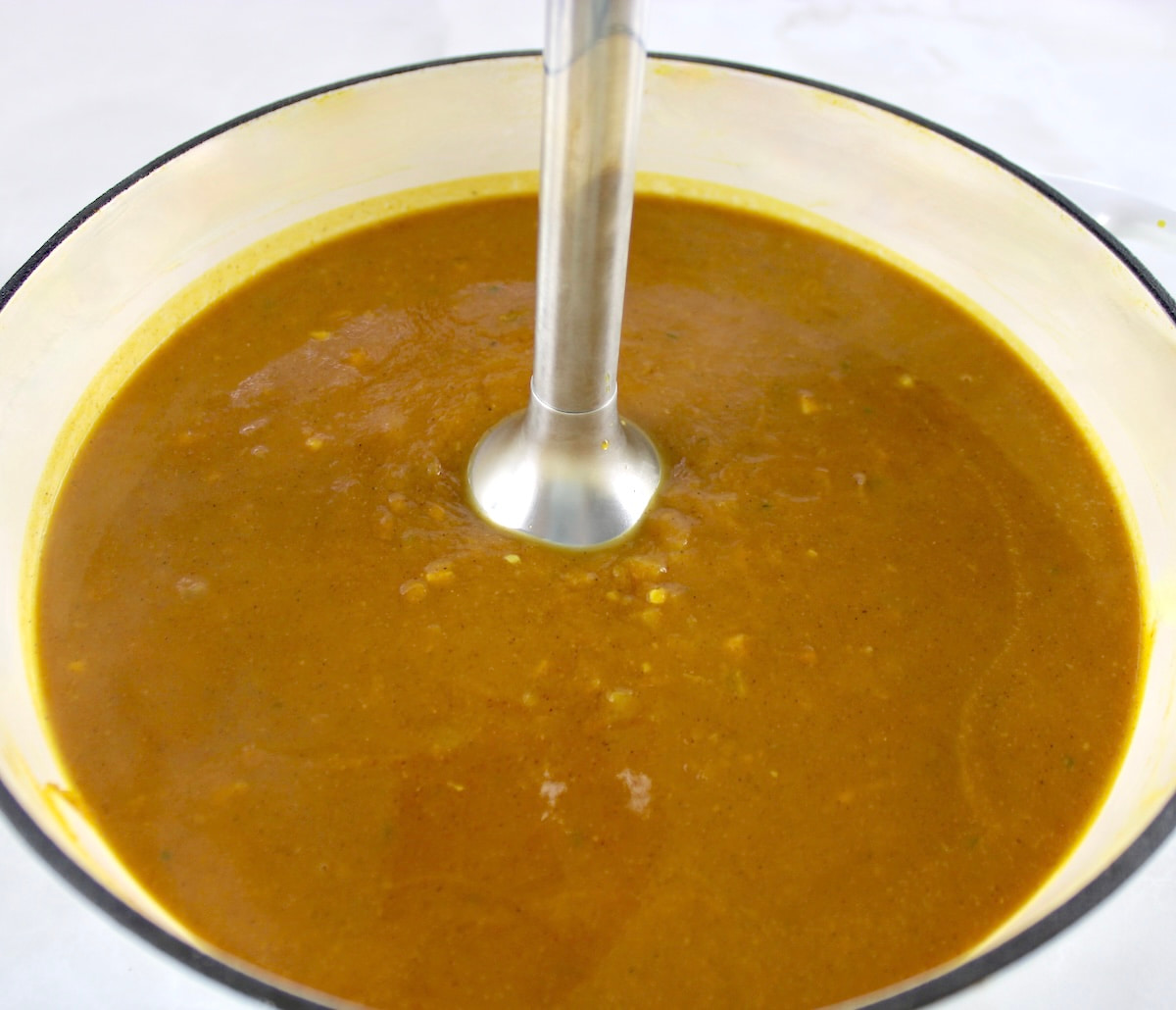 immersion blender in pot with Easy Pumpkin Soup