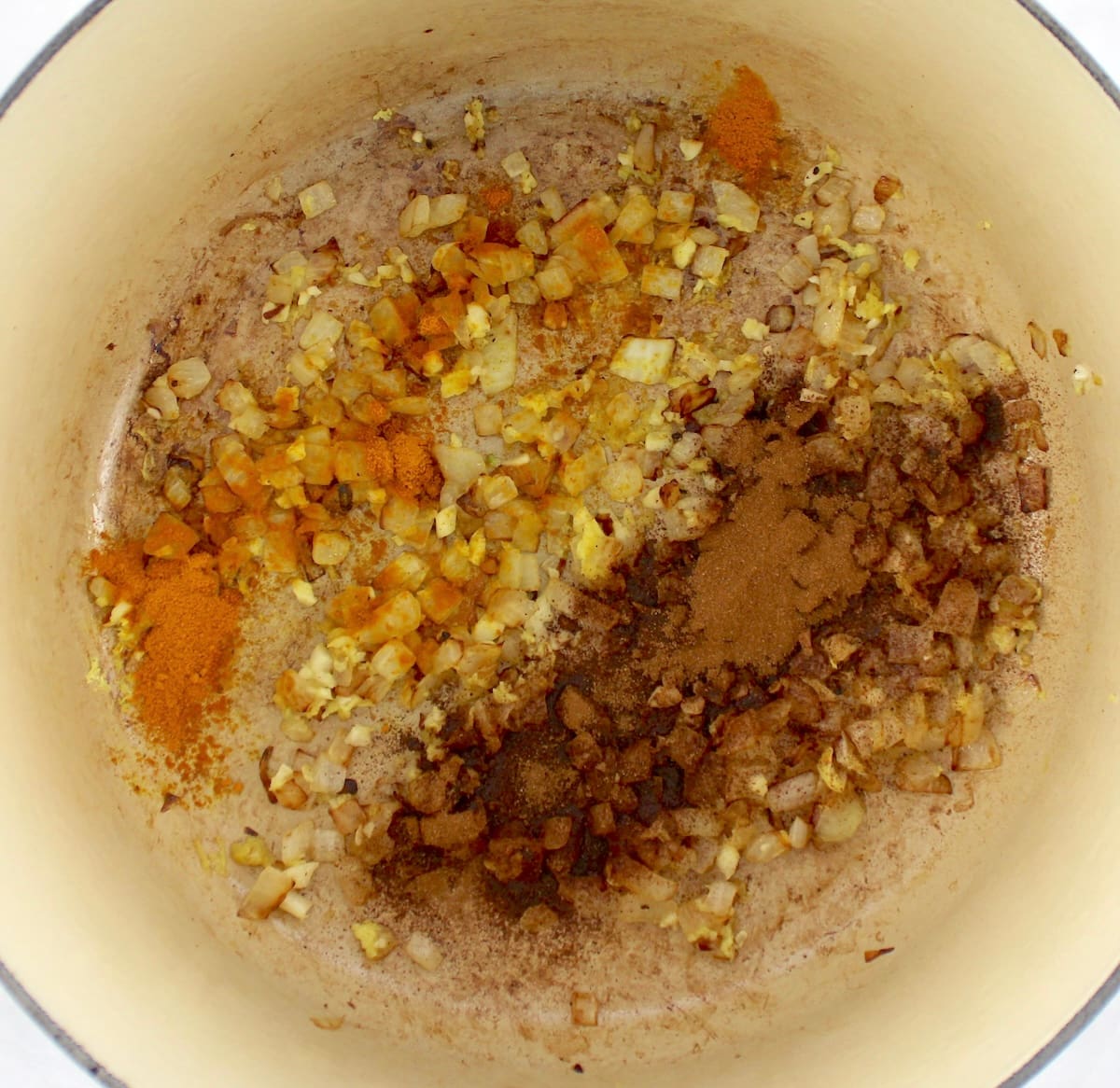 minced onions, garlic and spices on pot