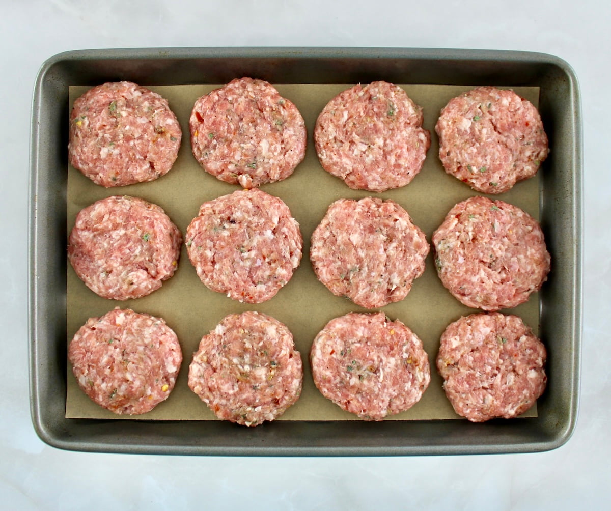 12 Homemade Breakfast Sausage patties uncooked on baking sheet