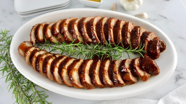 2 Honey Glazed Pork Tenderloins on white oval platter in slices