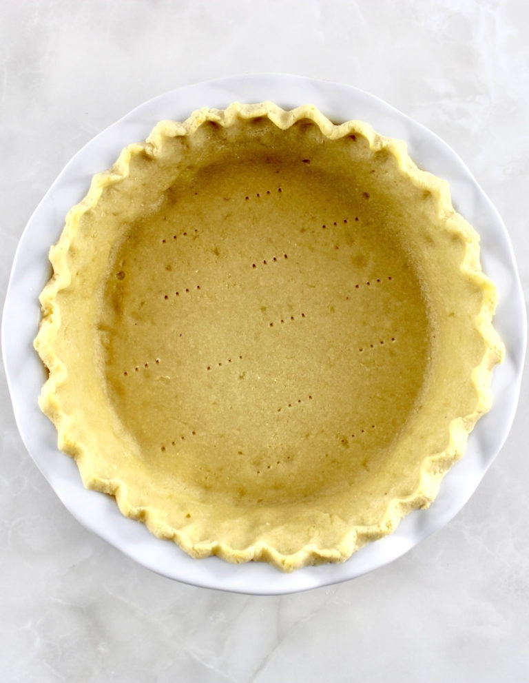 Keto Pie Crust in white pie dish