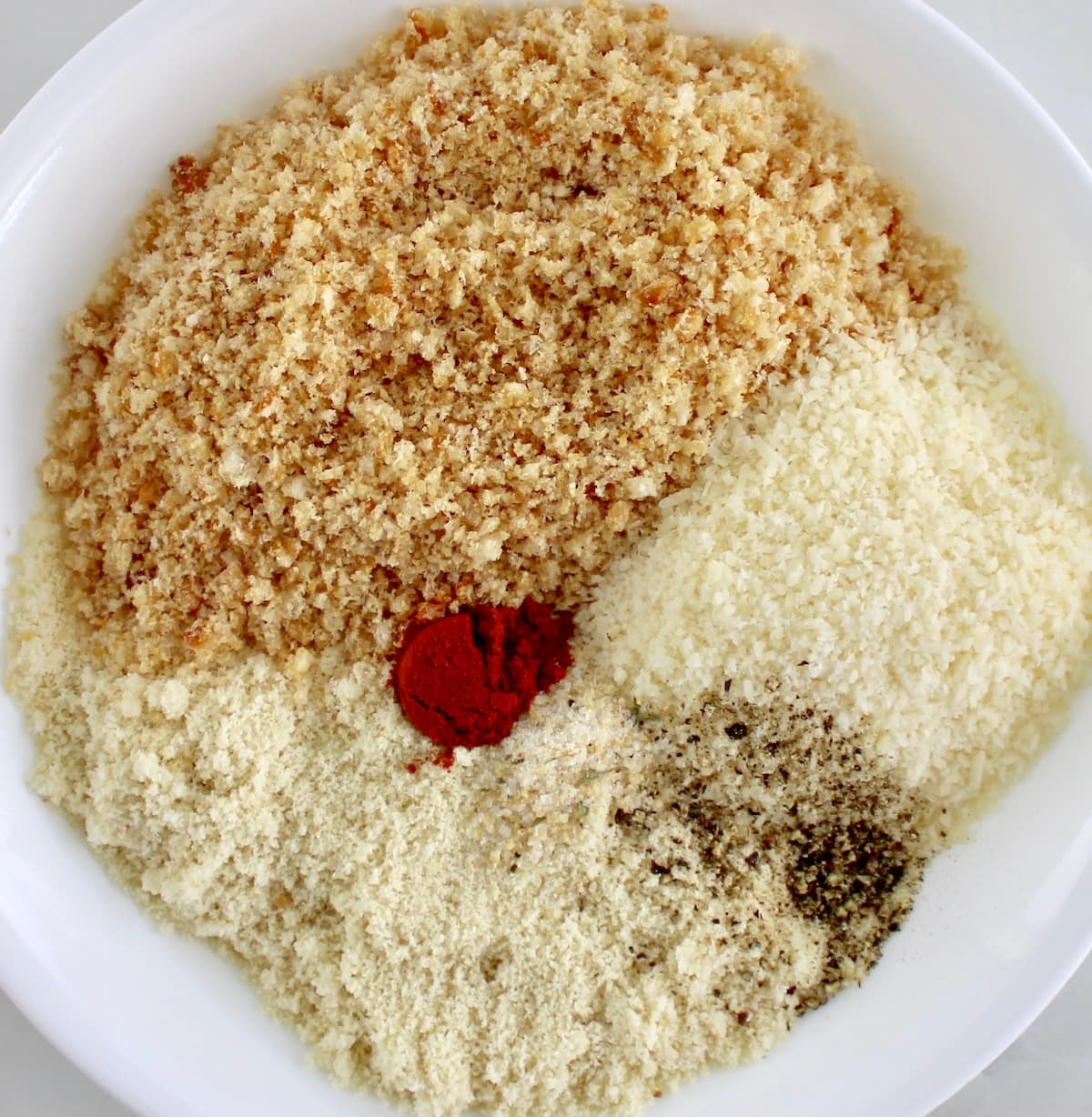 breading mixture for Keto Popcorn Chicken in white bowl