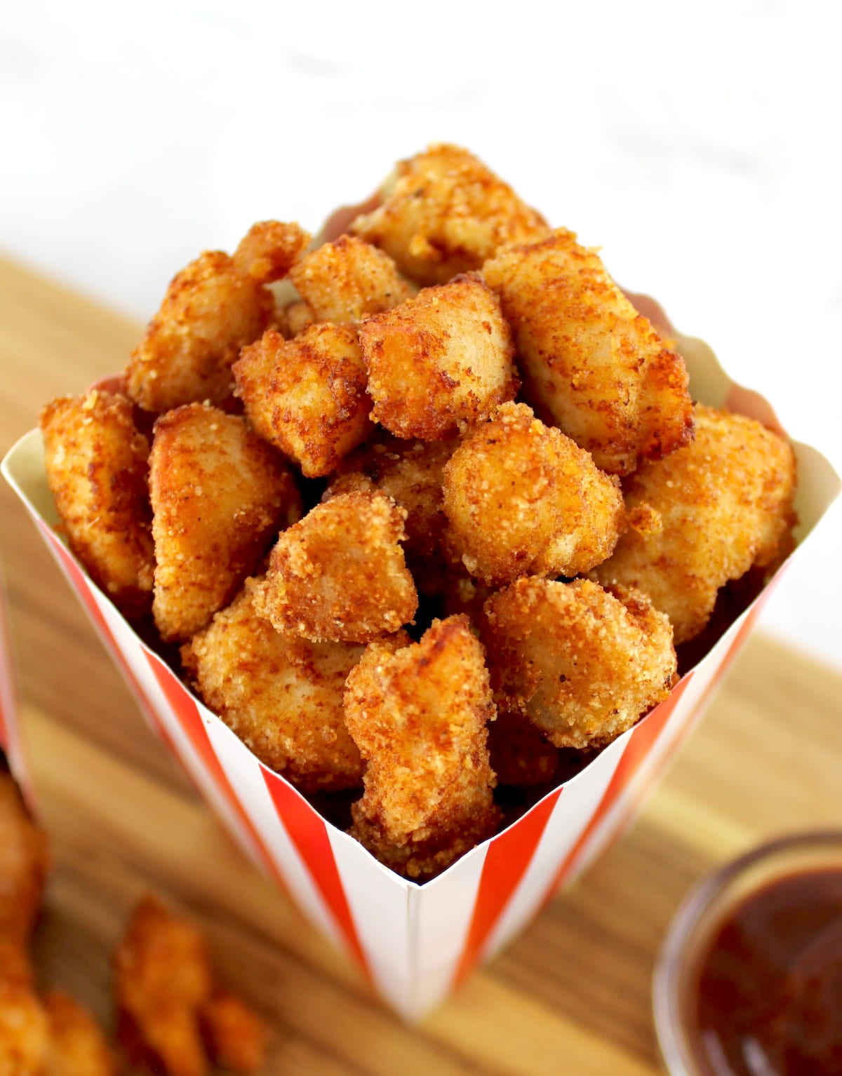 closeup overhead view of Keto Popcorn Chicken in popcorn container