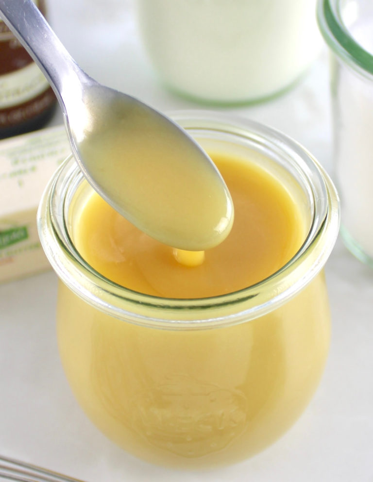 Keto Sweetened Condensed Milk in an open jar some spoonful