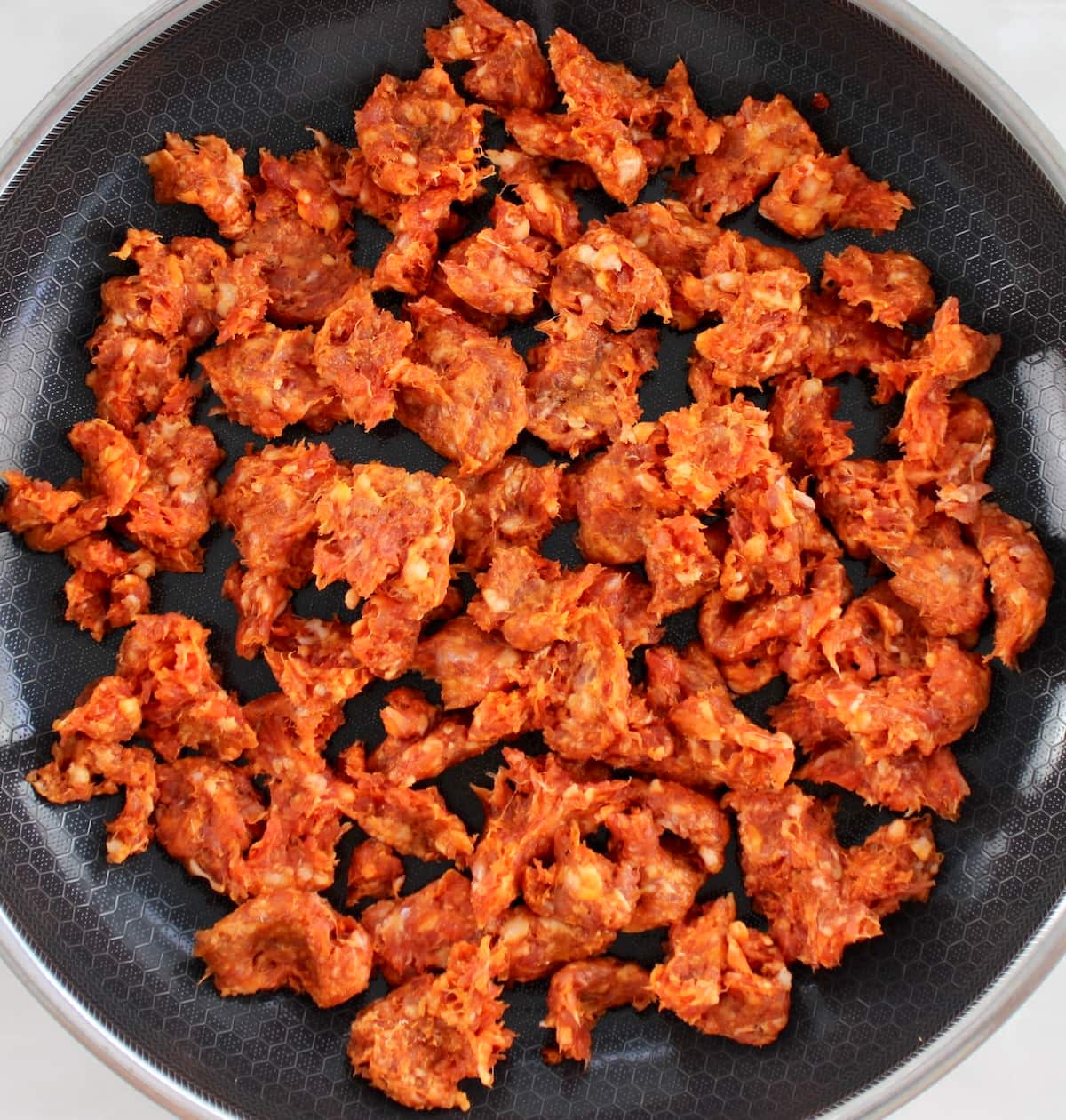 raw chorizo in skillet