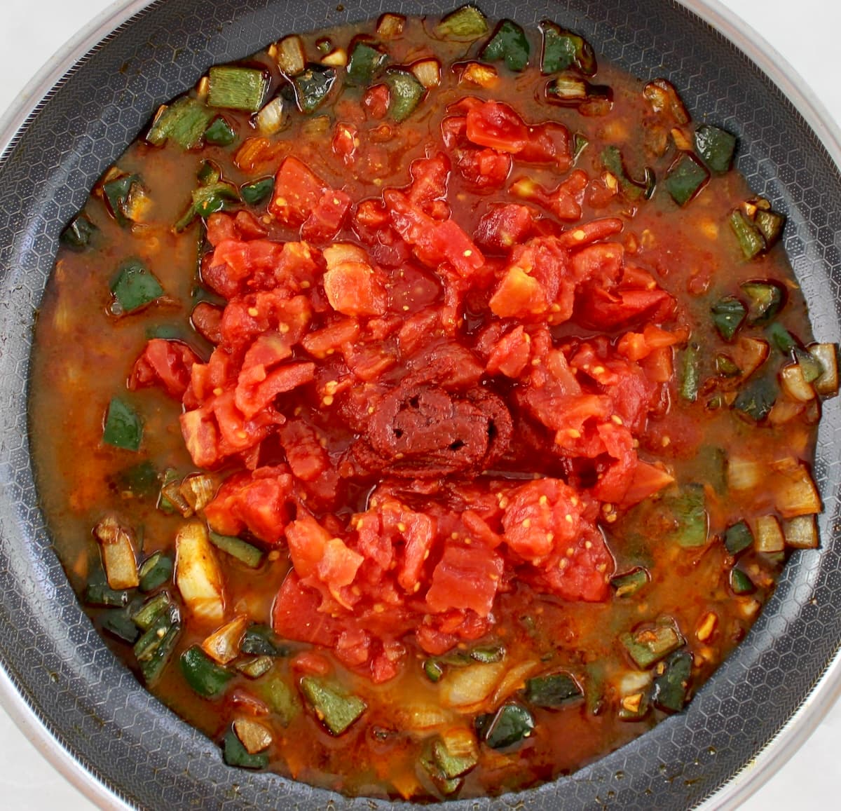 diced tomatoes, poblano peppers, onions, tomato paste and chicken broth