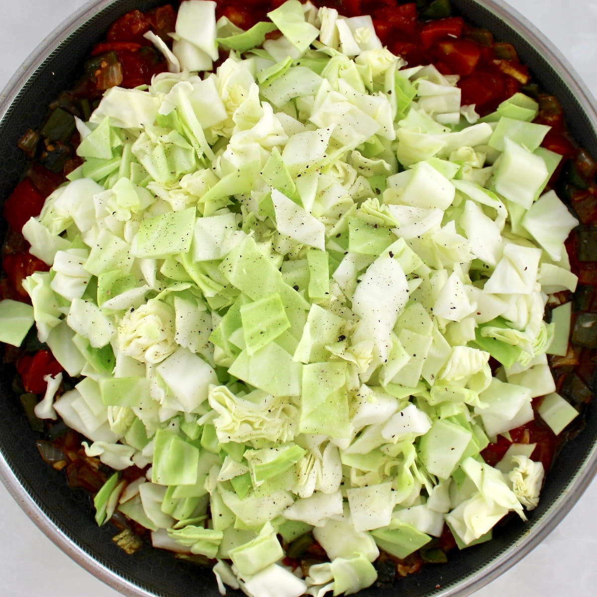 chopped raw cabbage in skillet