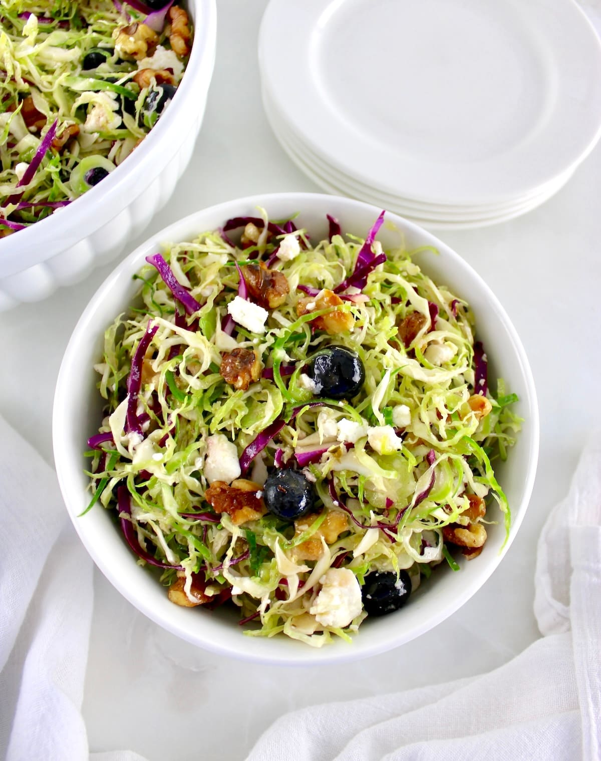 Shaved Brussels Sprouts Salad in a white bowl