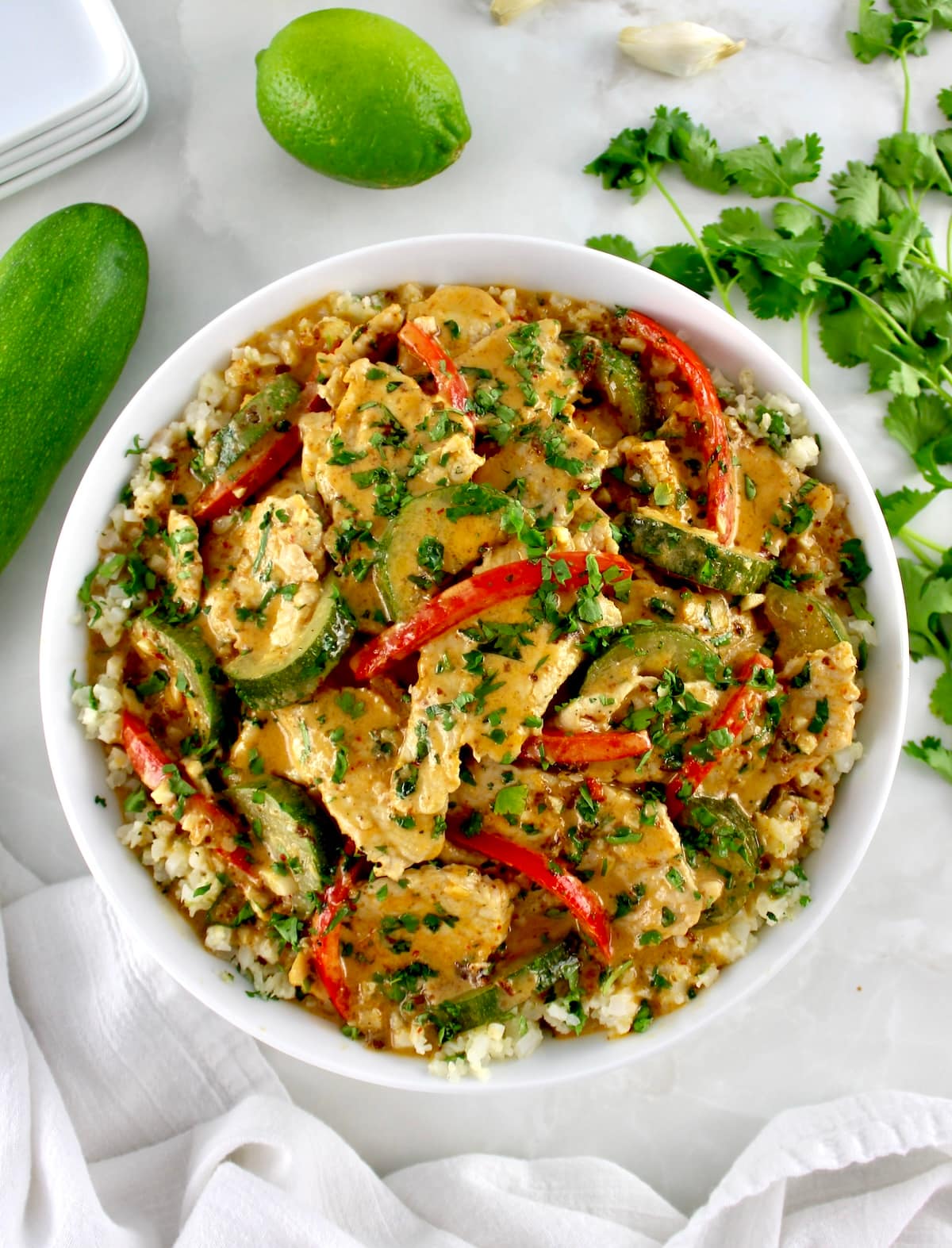 overhead view of Thai Red Curry Coconut Pork in white bowl