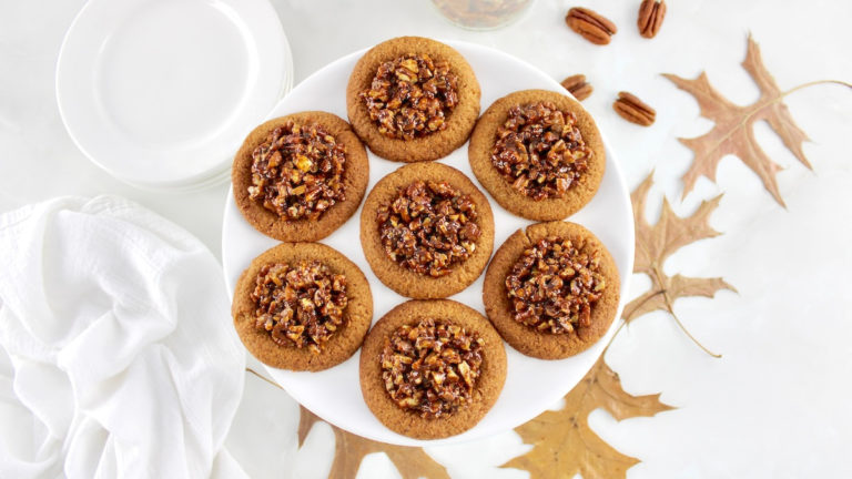 overhead view of 7 Pecan Pie Cookies on white cake stand