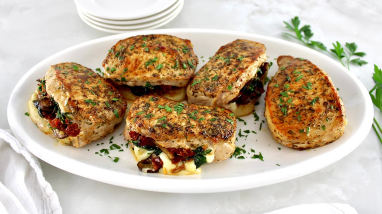 6 Stuffed Pork Chops on white oval platter