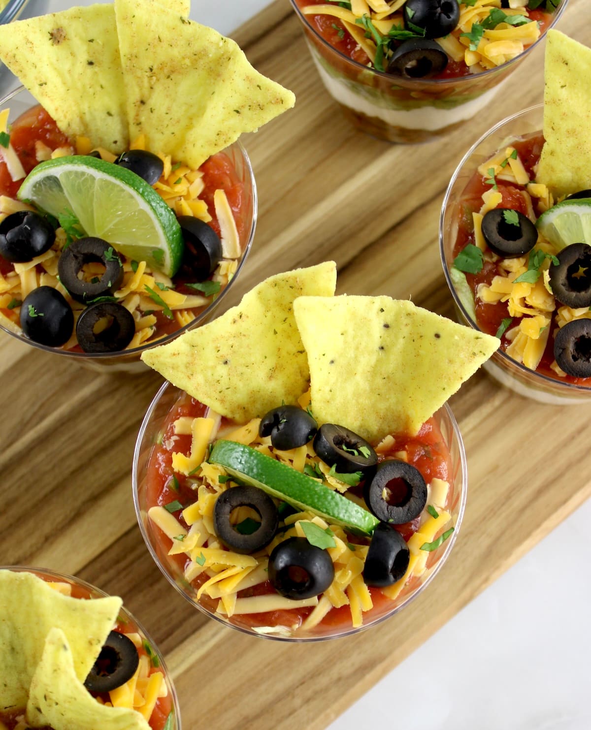 overhead view of Taco Dip Cups on cutting board