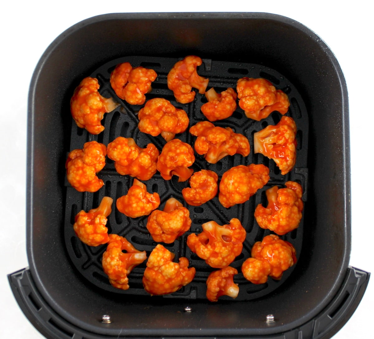 Air Fryer Buffalo Cauliflower in air fryer basket