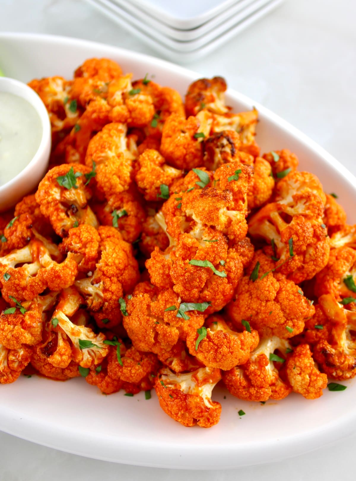 closeup of Air Fryer Buffalo Cauliflower on white plate