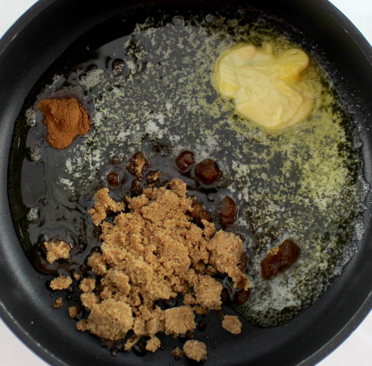 Maple Pecan Baked Brie sauce ingredients in skillet unmixed