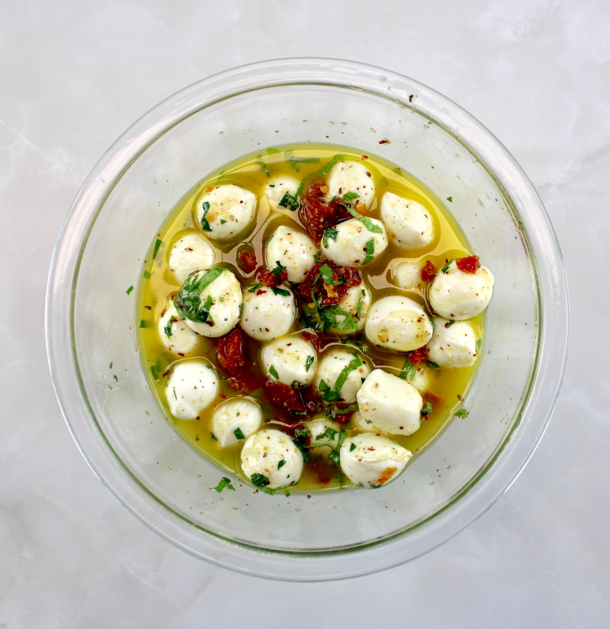 Marinated Mozzarella Balls (Ciliegine) in glass bowl