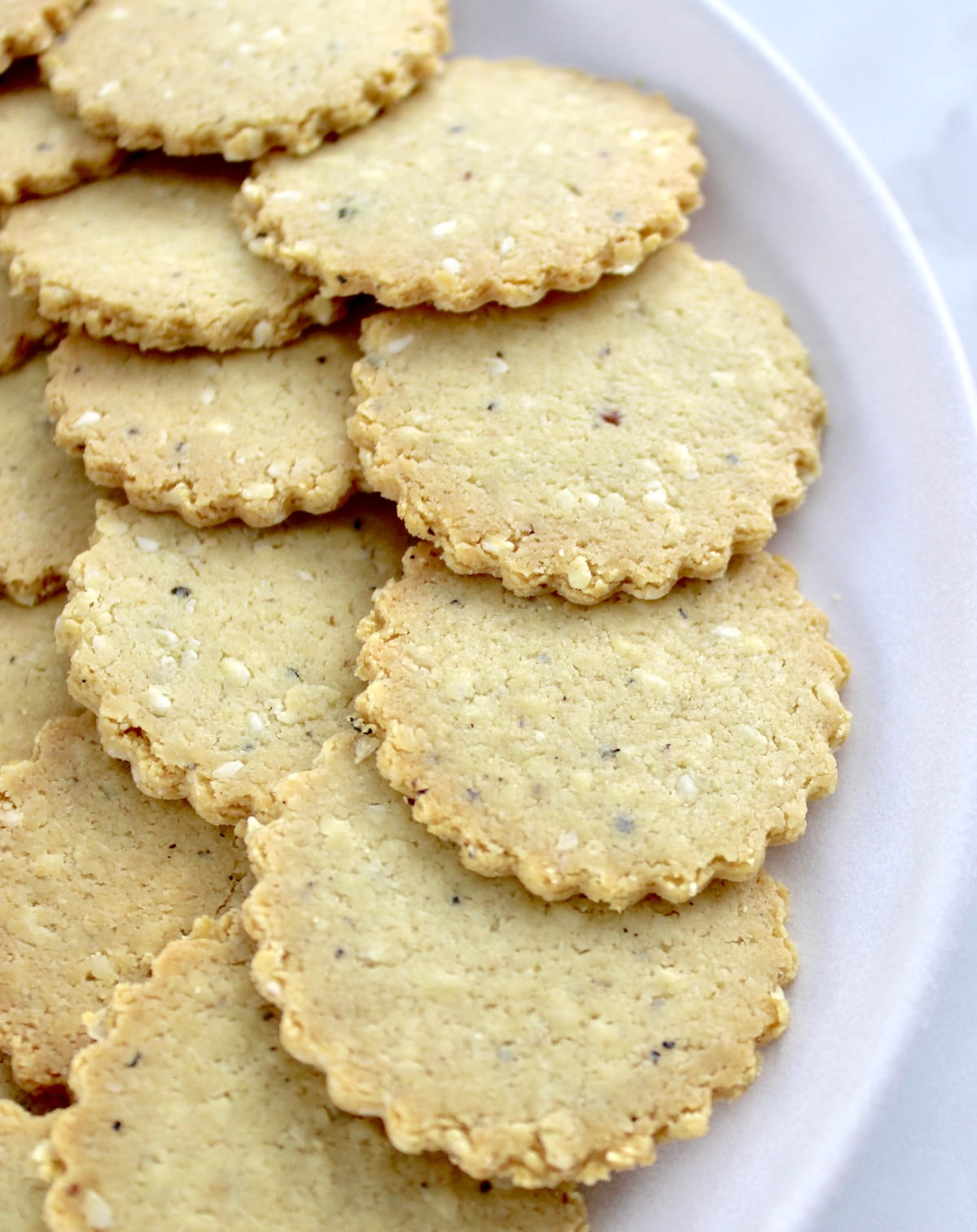 closeup of Sesame Almond Flour Crackers on white plate