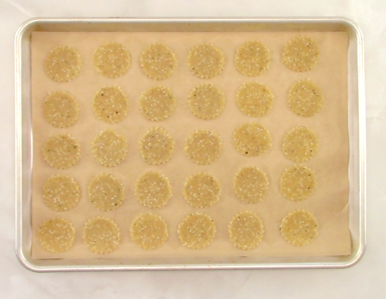 Sesame Almond Flour Crackers on parchment paper unbaked