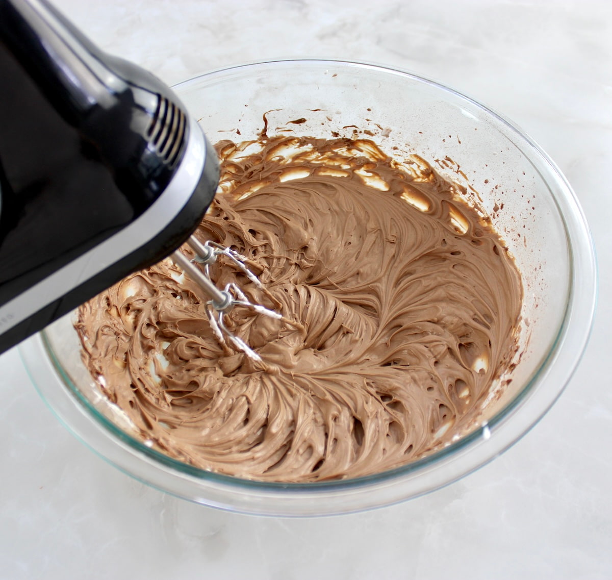 Espresso Chocolate Mousse in glass bowl with hand mixer