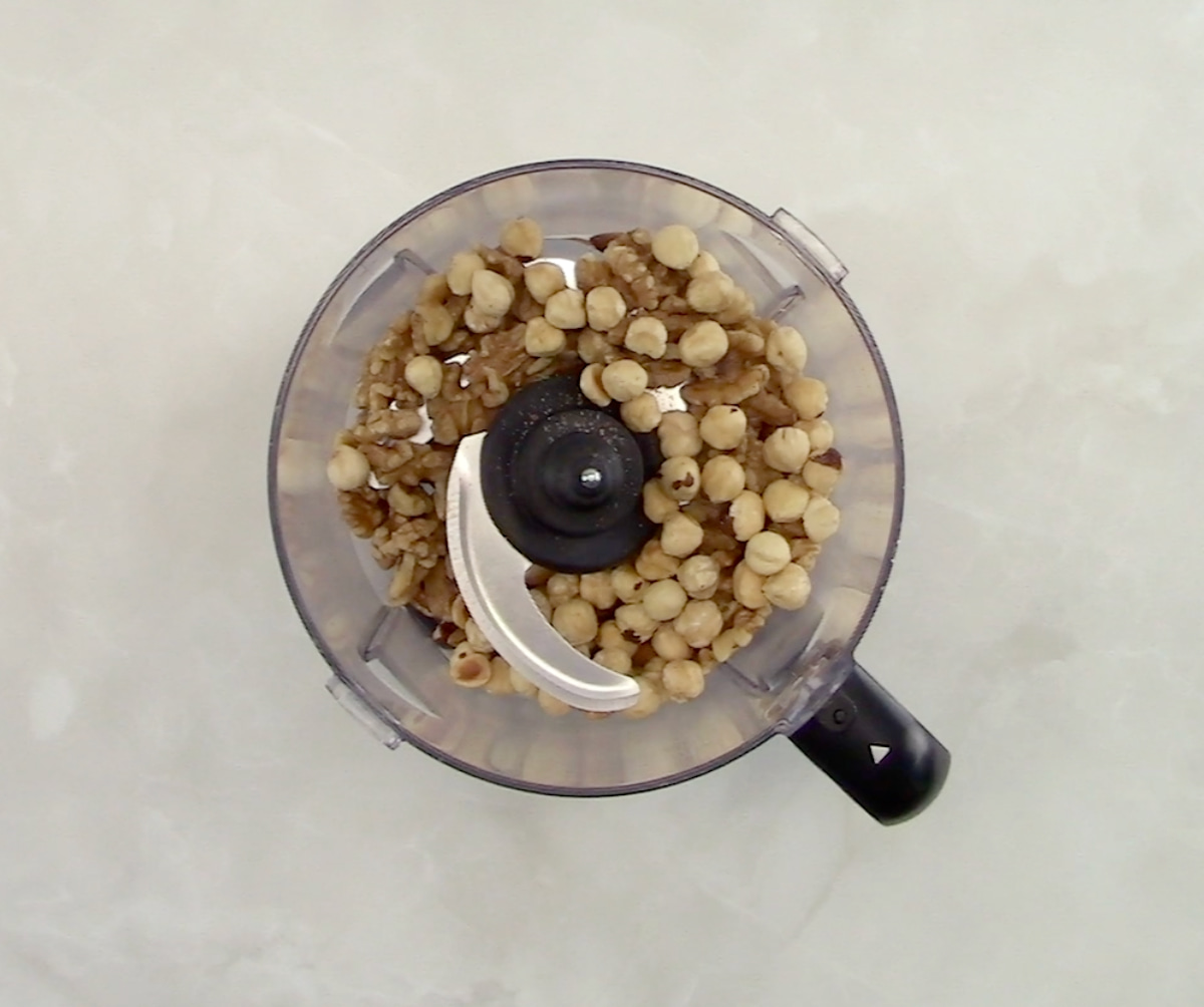mix of nuts in food processor bowl