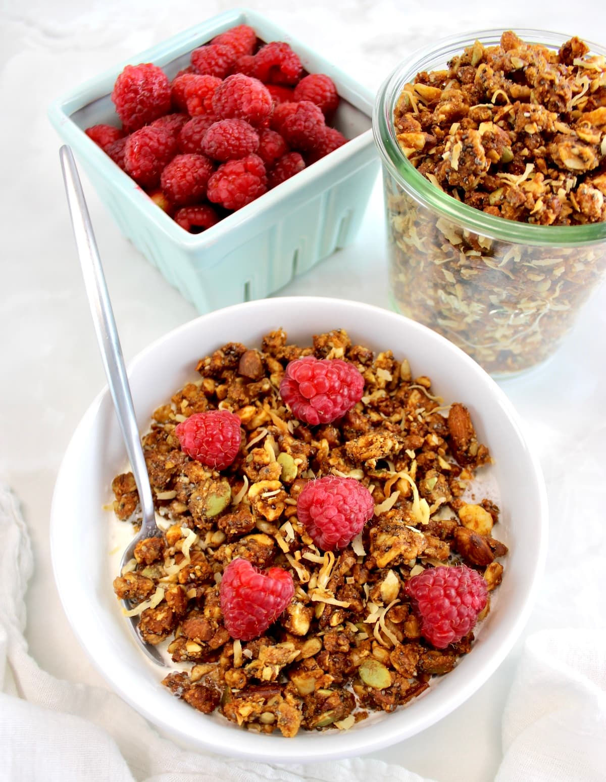 Keto Granola in bowl with raspberries