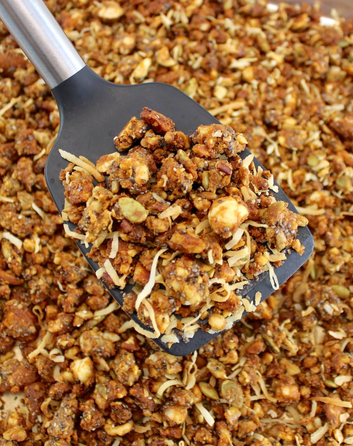Keto Granola being lifted with spatula