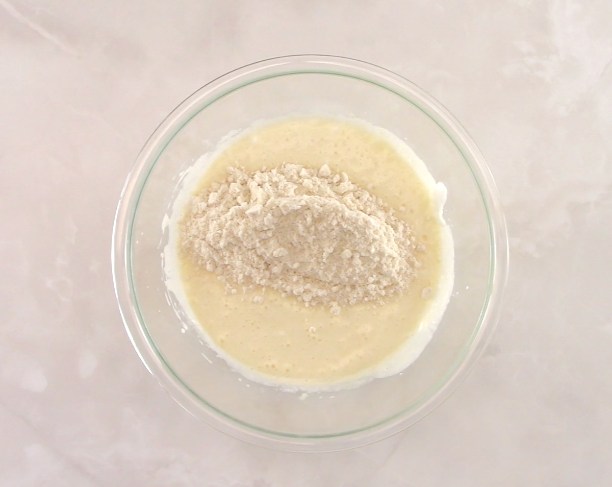 wet and dry ingredients for Keto Ricotta Pancakes in glass bowl unmixed
