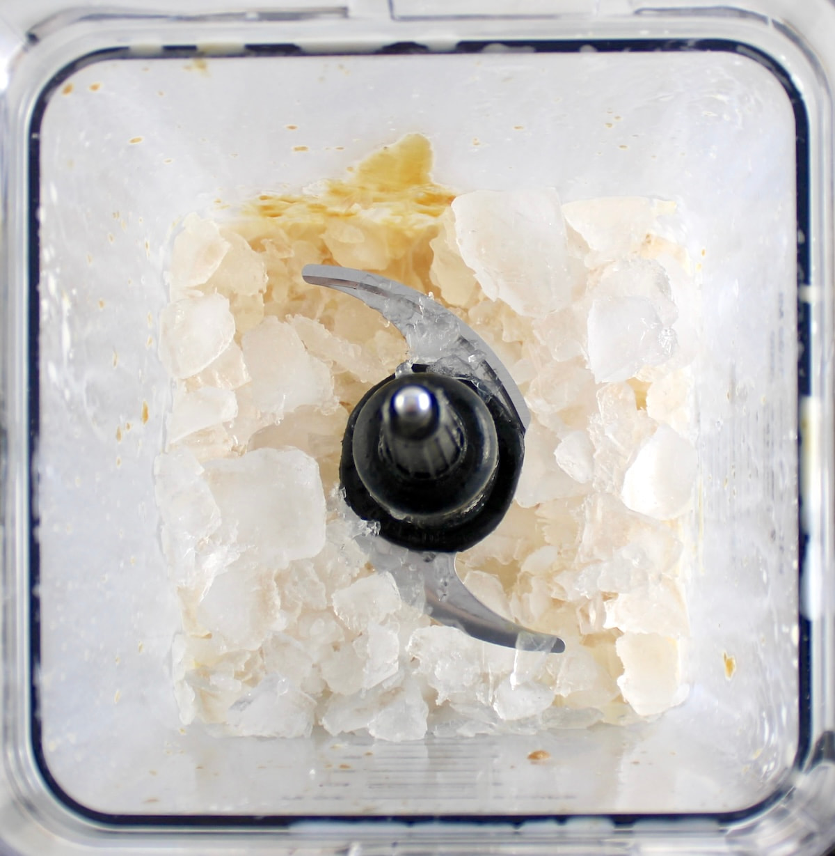 Keto Salted Caramel Milkshake with crushed ice on top in blender