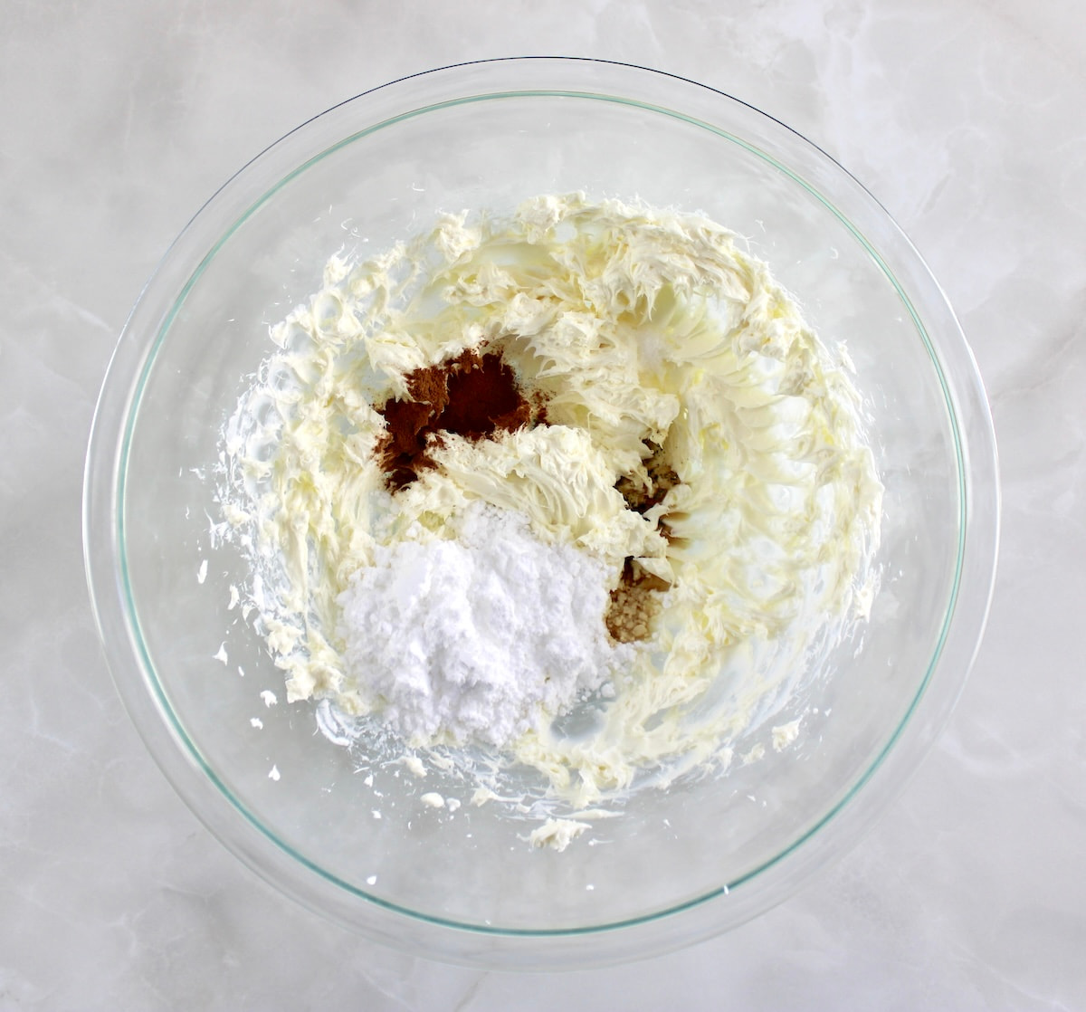 snickerdoodle cheesecake fluff ingredients in glass bowl unmixed