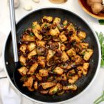 Marsala Mushroom Chicken Bites in skillet with serving spoon