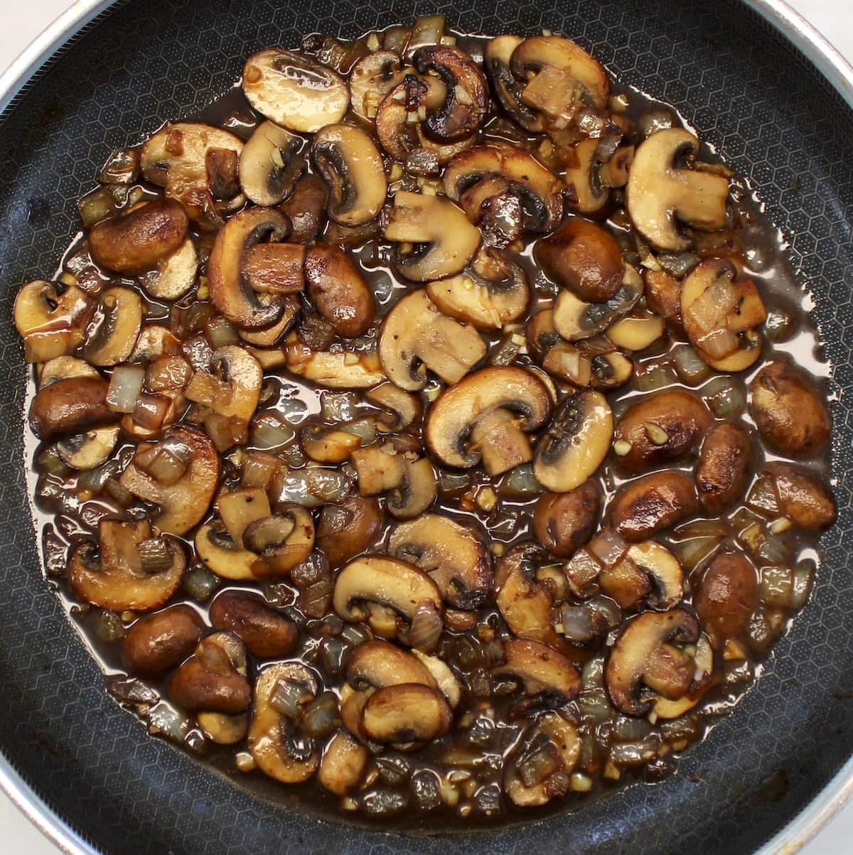 sauteed mushrooms, onions and minced garlic in skillet with marsala wine