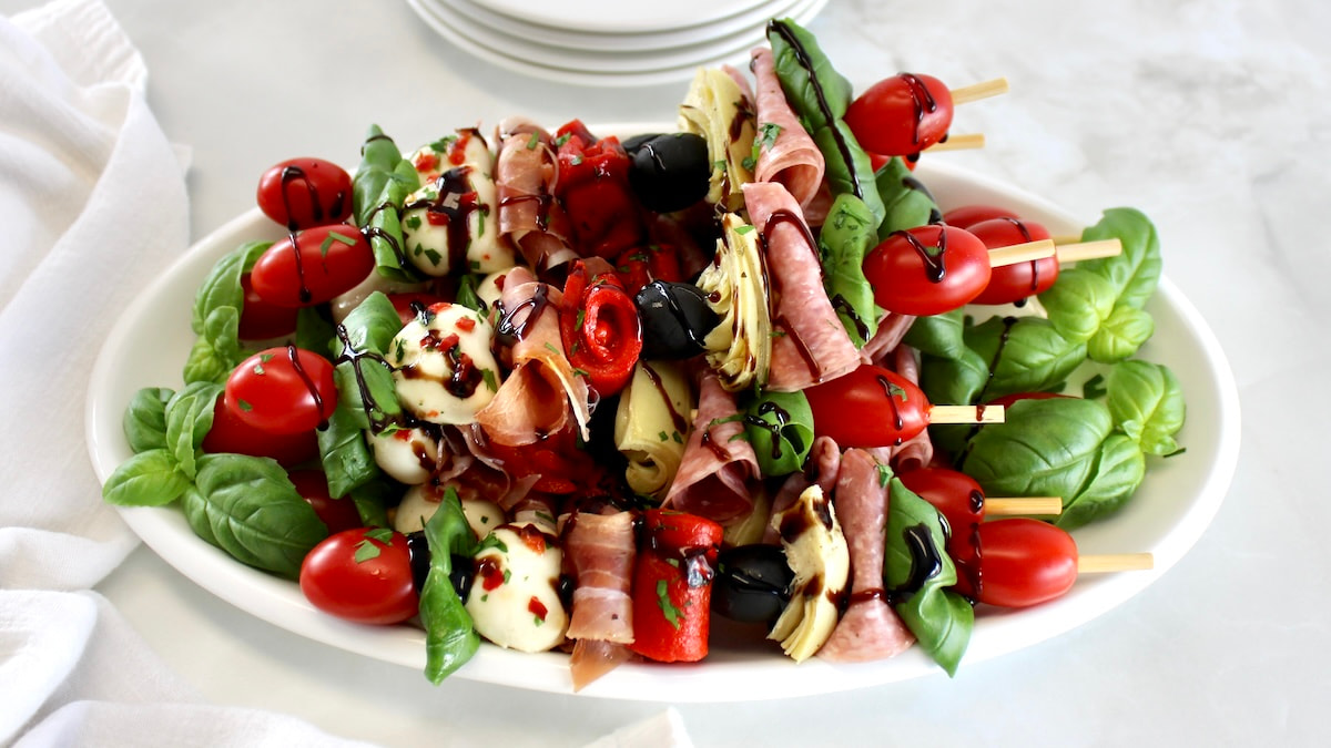 closeup of Italian Antipasti Skewers on white plate