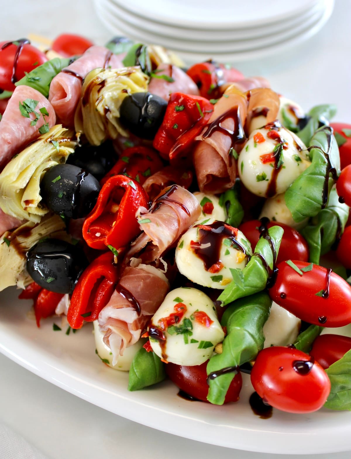 closeup pf Italian Antipasti Skewers on white plate