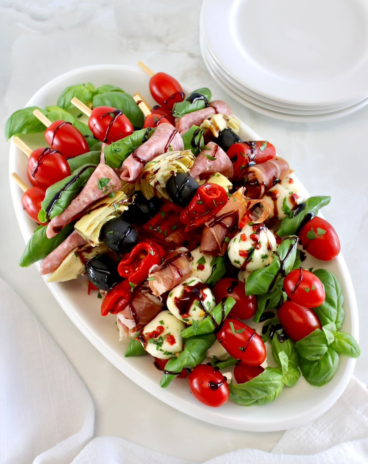 Italian Antipasti Skewers on white platter