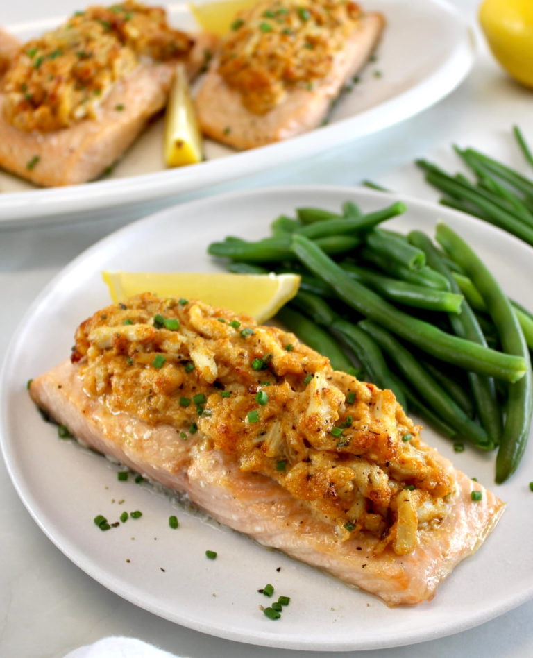 Cajun Crab Stuffed Salmon on white plate with green beans