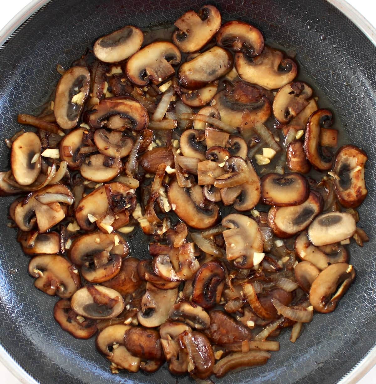sauteed mushrooms onions and garlic in  skillet