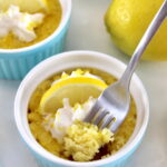 Keto Lemon Mug Cake in blue ramekin with fork
