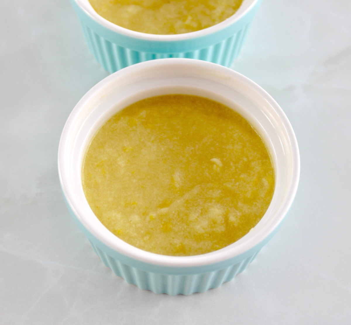 Keto Lemon Mug Cake in blue ramekins uncooked