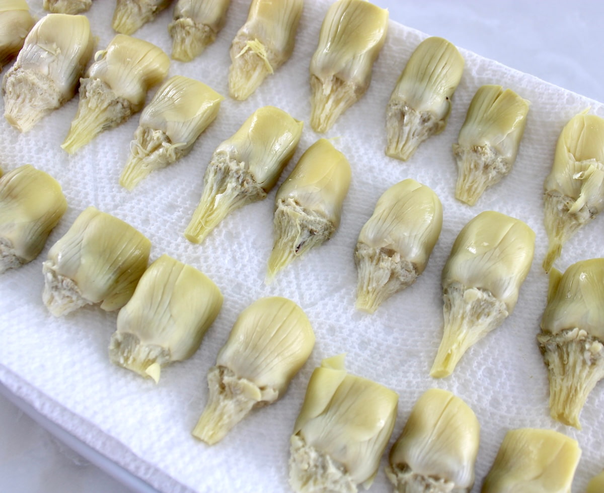 halved artichoke hearts on paper towels