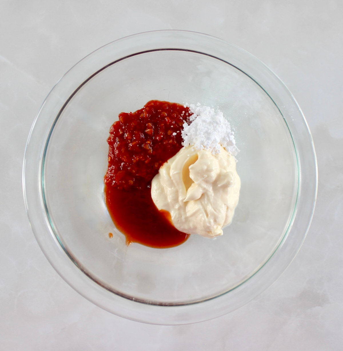 Bang Bang Sauce ingredients in glass bowl unmixed