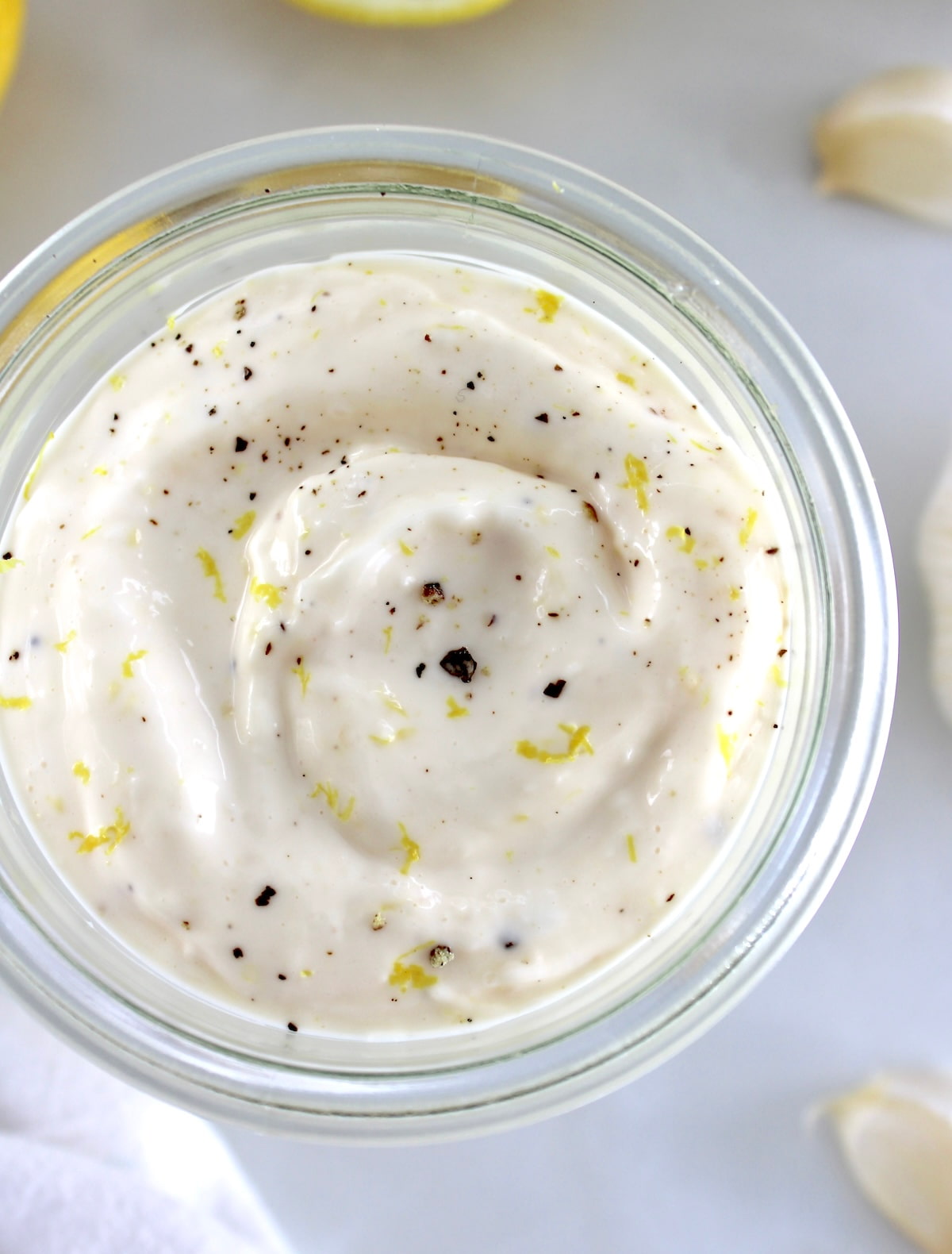 overhead view of Easy Garlic Aioli in open glass jar