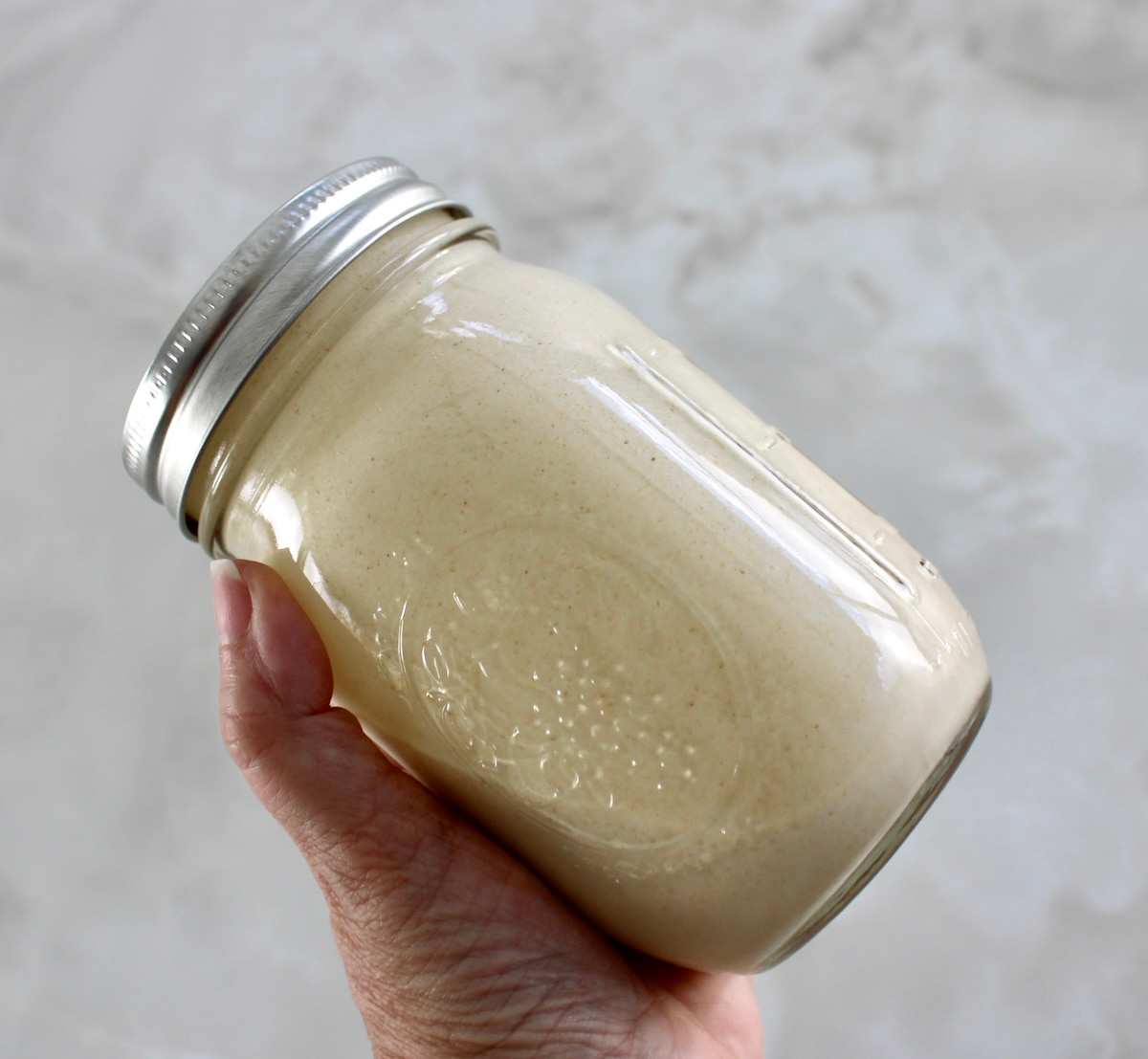holding Peanut Butter Cup Mason Jar Ice Cream in mason jar
