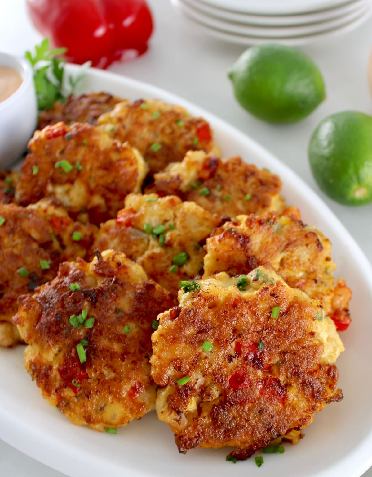 closeup of Shrimp Cakes with Spicy Mayo on white platter