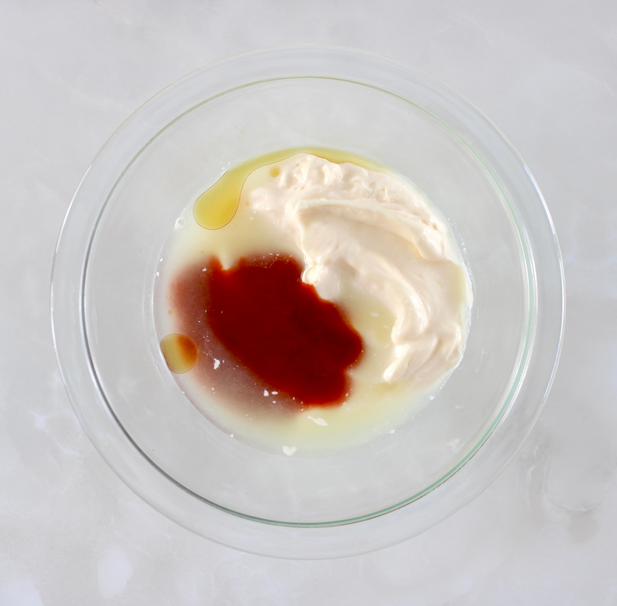 Spicy Mayo ingredients in glass bowl unmixed