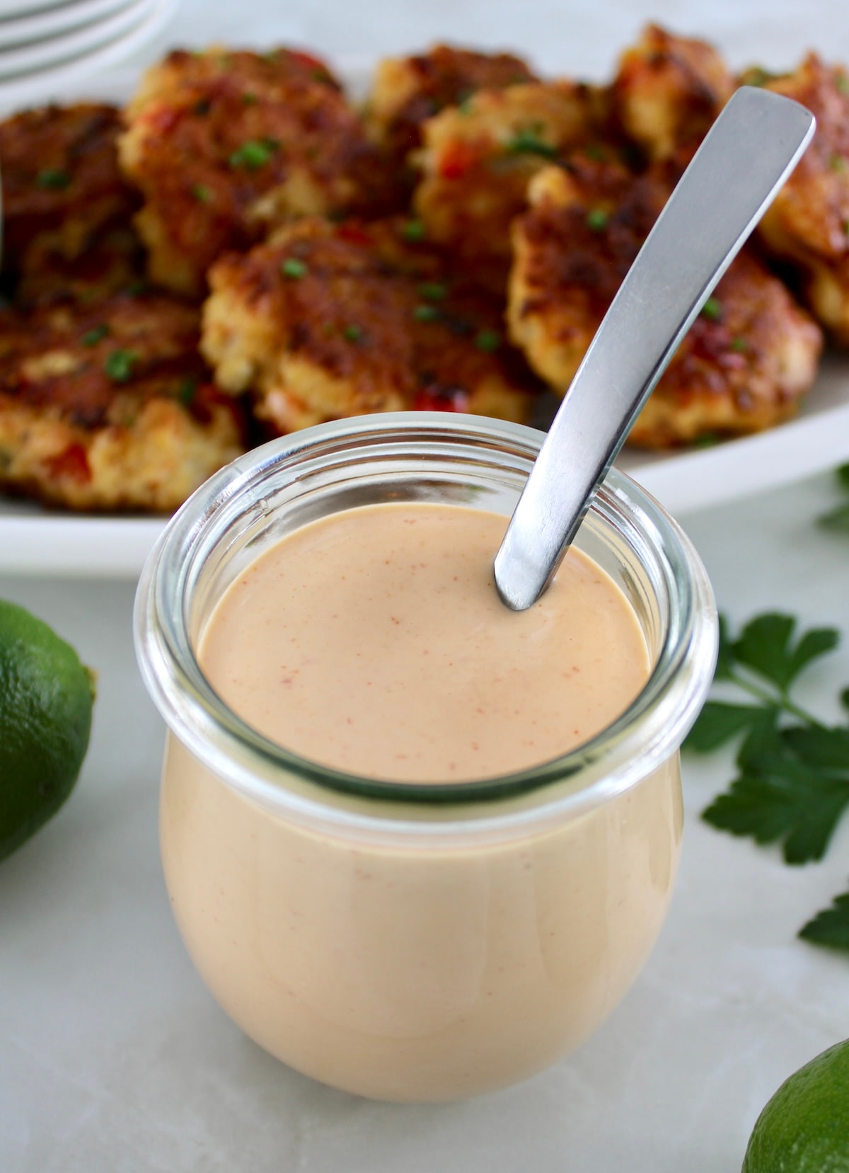 Spicy Mayo in open glass jar with spoon