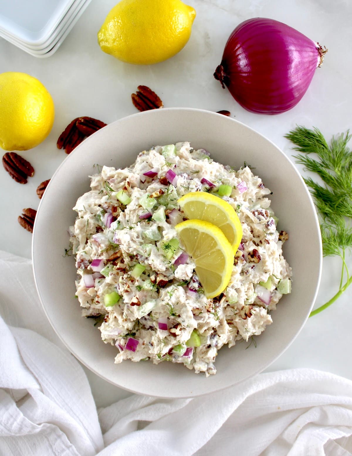 overhead view of Cottage Cheese Chicken Salad in bowl with lemon slices