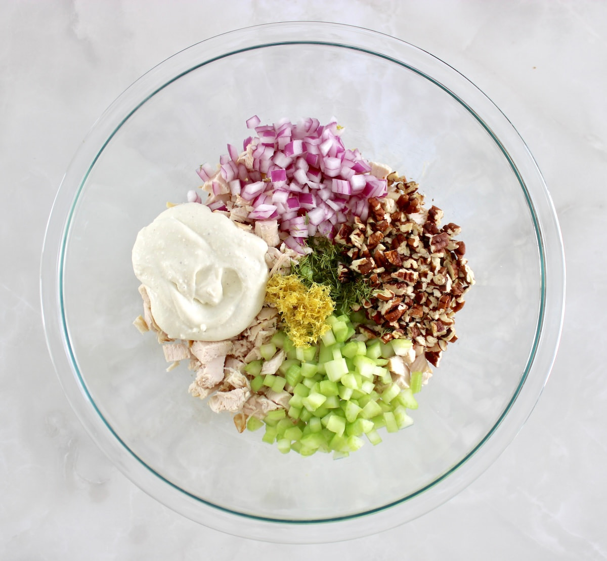 Cottage Cheese Chicken Salad ingredients with dressing in sections unmixed